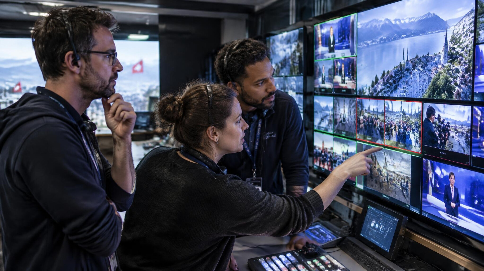 Production team reviewing live video feeds on monitors